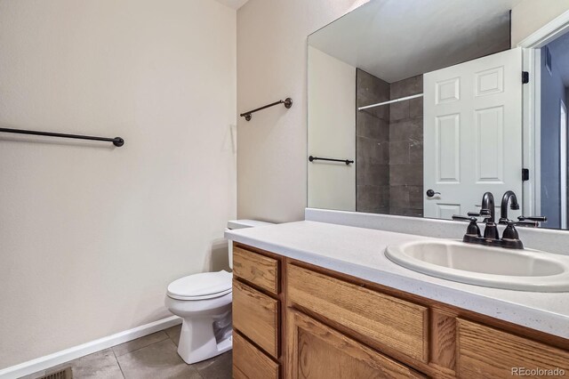 21767 Silver Meadow Ln, Parker, CO 80138 - bathroom featuring vanity, a tile shower, and tile patterned flooring