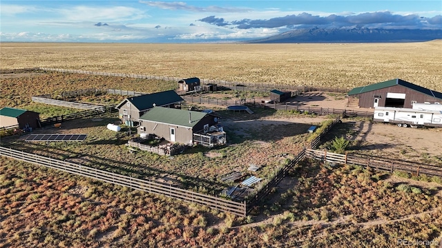 birds eye view of property featuring a rural view