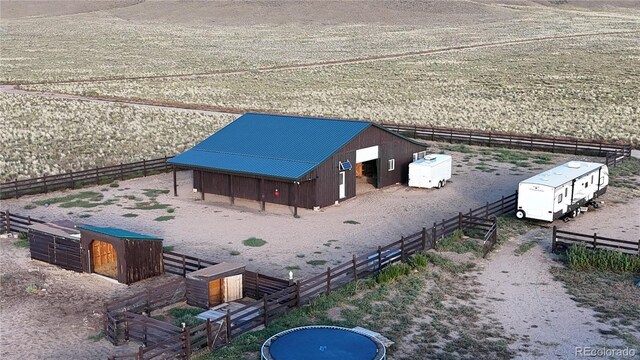 birds eye view of property with a rural view