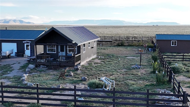 exterior space with a deck with mountain view