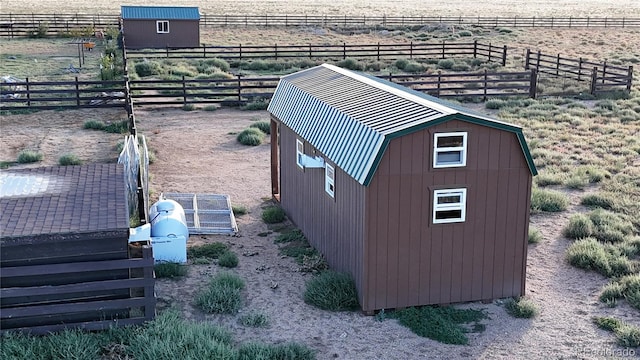 view of outbuilding featuring a rural view