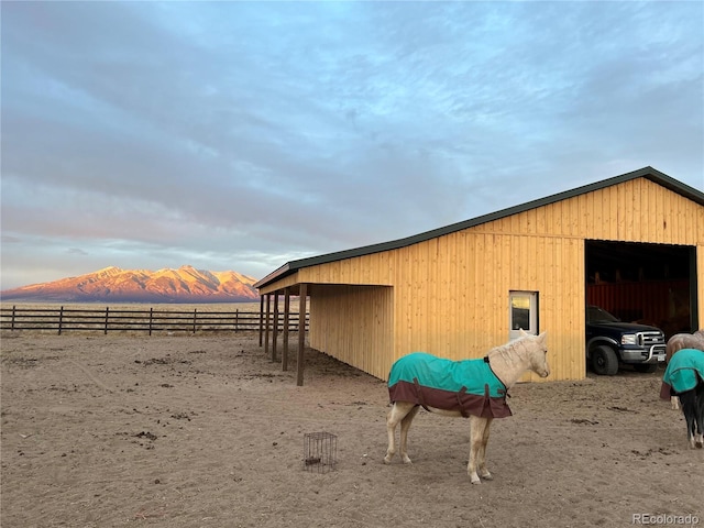 view of outbuilding featuring a mountain view