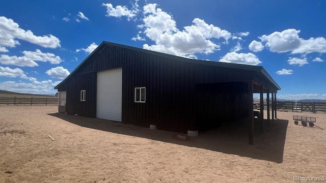 view of outbuilding featuring a rural view