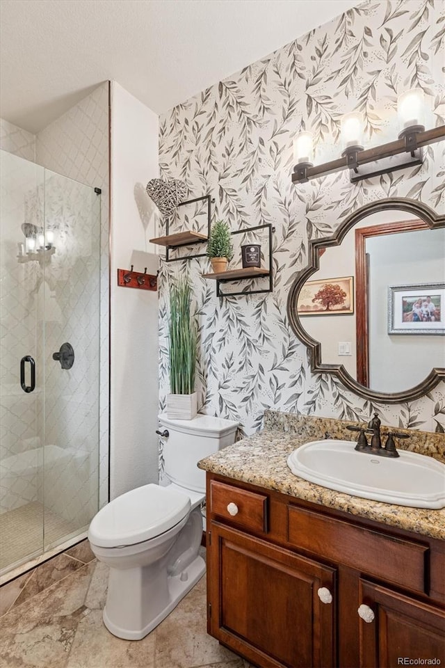 7804 Silverweed Way, Lone Tree, CO 80124 - bathroom featuring wallpapered walls, vanity, toilet, and a stall shower