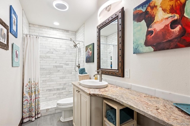 7804 Silverweed Way, Lone Tree, CO 80124 - bathroom featuring toilet, vanity, and tiled shower