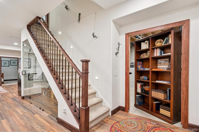 7804 Silverweed Way, Lone Tree, CO 80124 - stairway featuring wood finished floors and baseboards
