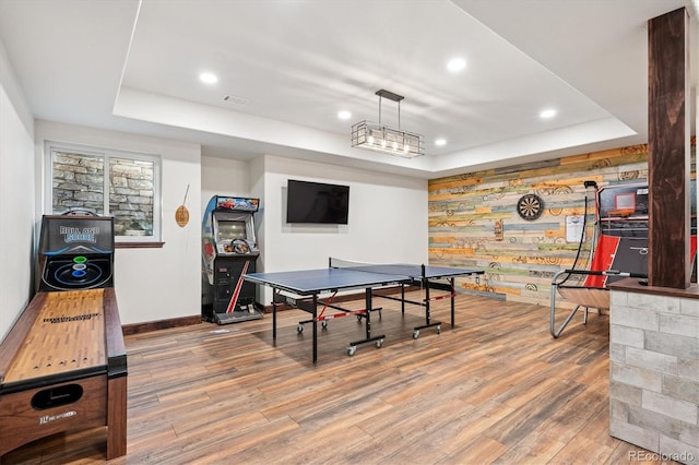 7804 Silverweed Way, Lone Tree, CO 80124 - playroom featuring a raised ceiling, wood finished floors, baseboards, and recessed lighting