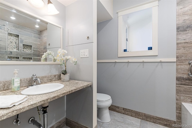 1121 S Ogden St, Denver, CO 80210 - full bath with toilet, vanity, tiled shower, and tile patterned flooring
