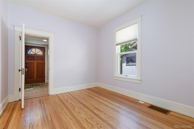 1121 S Ogden St, Denver, CO 80210 - empty room with baseboards and light wood-style flooring