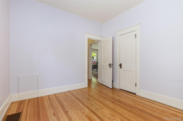 1121 S Ogden St, Denver, CO 80210 - spare room featuring light wood-type flooring and baseboards