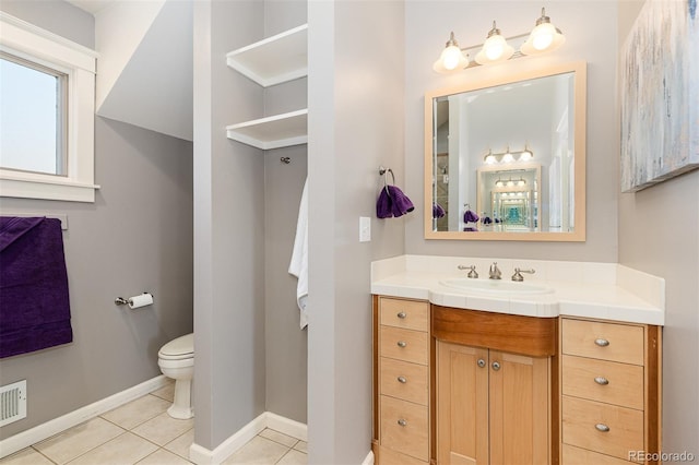 1121 S Ogden St, Denver, CO 80210 - bathroom featuring vanity, tile patterned flooring, baseboards, and toilet