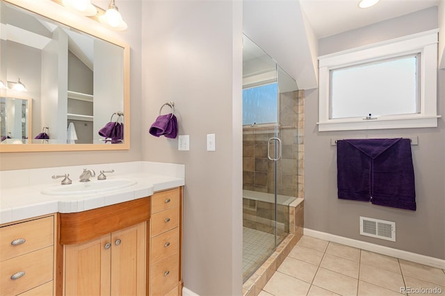 1121 S Ogden St, Denver, CO 80210 - full bathroom featuring baseboards, vanity, a shower stall, and tile patterned flooring