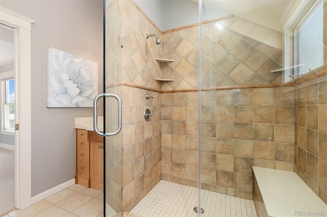 1121 S Ogden St, Denver, CO 80210 - full bathroom with a shower stall, tile patterned floors, vanity, and baseboards