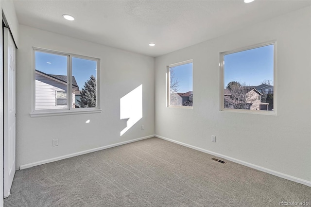 spare room with carpet floors