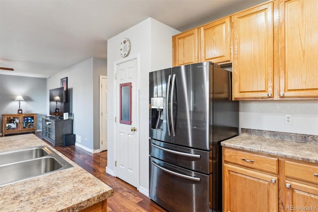 kitchen featuring light brown cabinetry, sink, ceiling fan, stainless steel refrigerator with ice dispenser, and dark hardwood / wood-style flooring