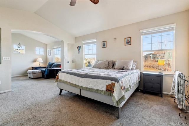 carpeted bedroom featuring vaulted ceiling and ceiling fan