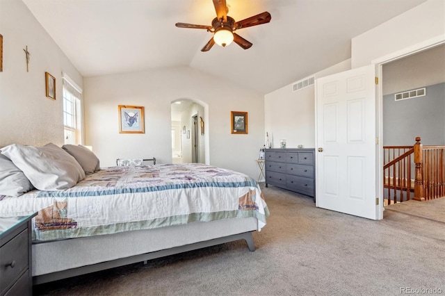 carpeted bedroom featuring vaulted ceiling and ceiling fan