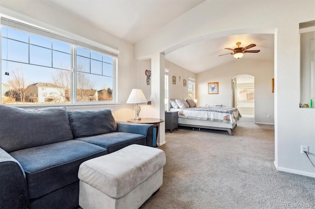 bedroom featuring vaulted ceiling, ceiling fan, and carpet