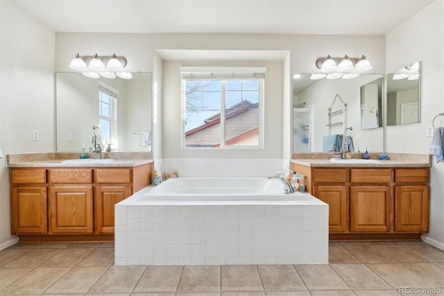 bathroom with vanity, shower with separate bathtub, and tile patterned flooring