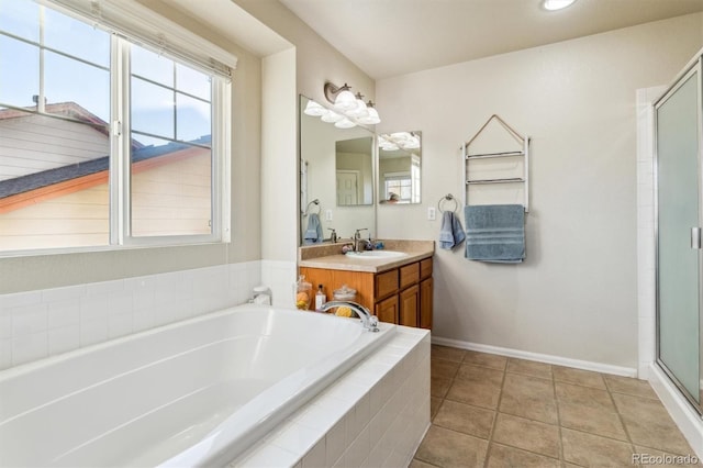 bathroom with vanity, tile patterned flooring, and separate shower and tub