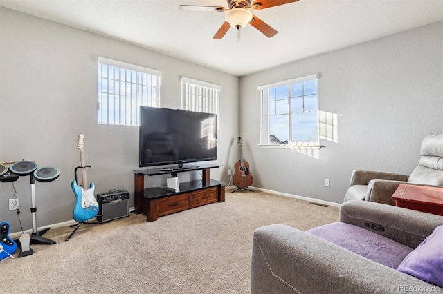 living room featuring light colored carpet and ceiling fan