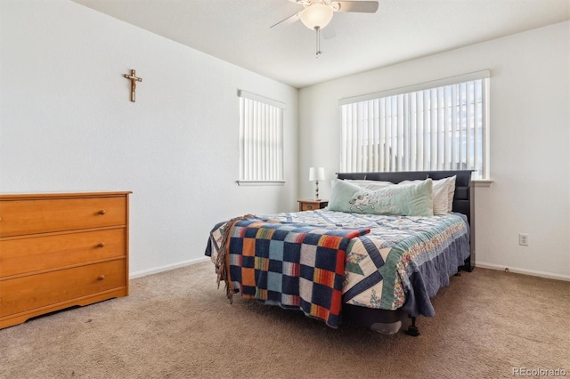 bedroom featuring ceiling fan and light carpet