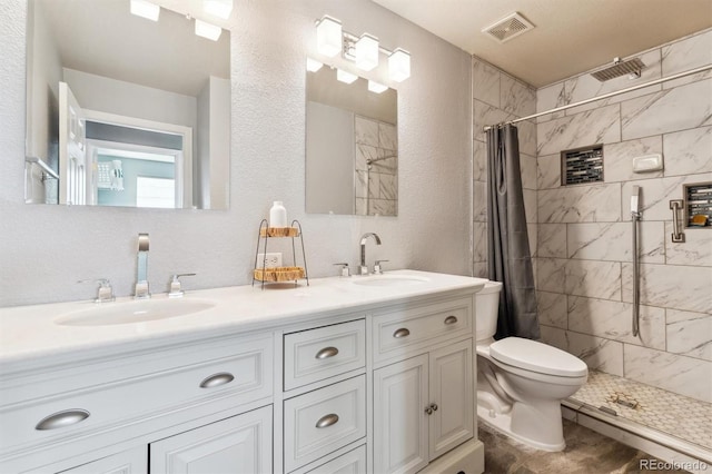 bathroom with a shower with curtain, vanity, and toilet