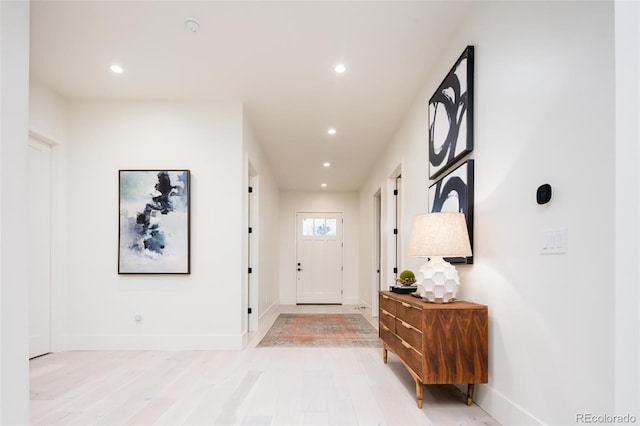 interior space with light wood-style floors, recessed lighting, and baseboards