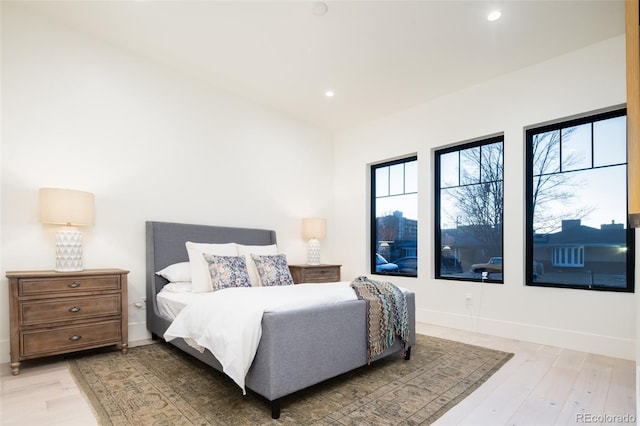 bedroom featuring recessed lighting, light wood-style flooring, and baseboards