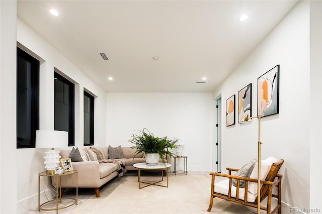 living room with baseboards and recessed lighting