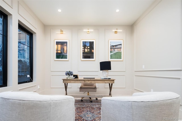 office area with recessed lighting and a decorative wall