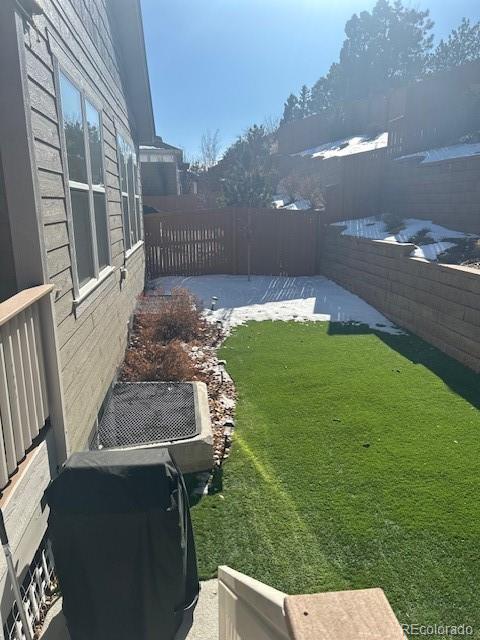 view of yard featuring a patio and central AC