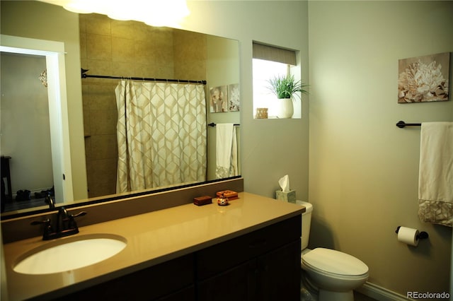 full bathroom with toilet, vanity, and a shower with curtain