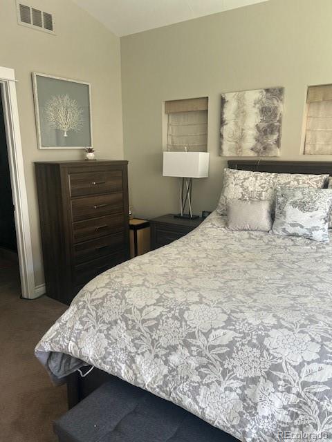 bedroom featuring visible vents and carpet floors