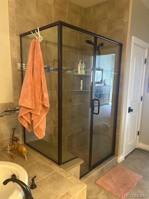 bathroom with a shower stall