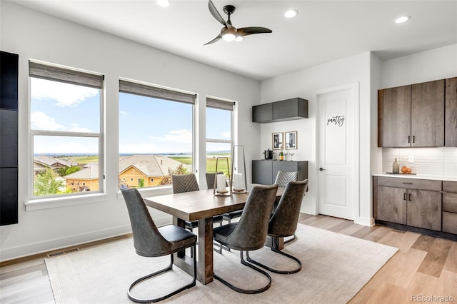16262 W 95th Ln, Arvada, CO 80007 - dining area featuring plenty of natural light, ceiling fan, light wood-style floors, and recessed lighting