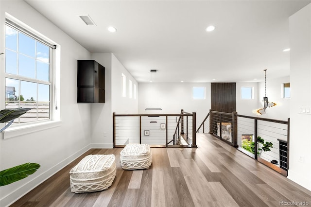 16262 W 95th Ln, Arvada, CO 80007 - sitting room with an upstairs landing, wood finished floors, and recessed lighting