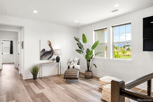 16262 W 95th Ln, Arvada, CO 80007 - sitting room with plenty of natural light, wood finished floors, and recessed lighting