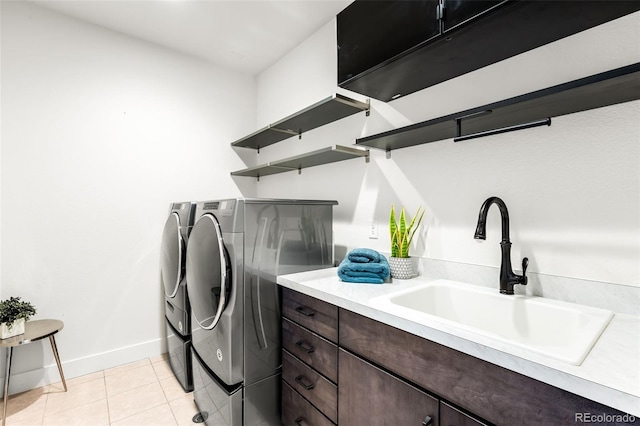 16262 W 95th Ln, Arvada, CO 80007 - laundry room with washing machine and clothes dryer, cabinet space, and light tile patterned flooring
