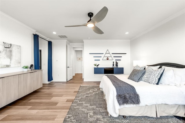 16262 W 95th Ln, Arvada, CO 80007 - bedroom with crown molding, light wood-type flooring, recessed lighting, and a ceiling fan