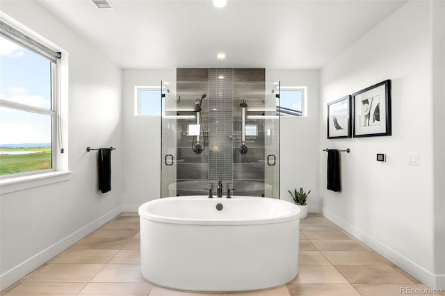16262 W 95th Ln, Arvada, CO 80007 - full bath featuring tile patterned flooring, a freestanding tub, a stall shower, and recessed lighting