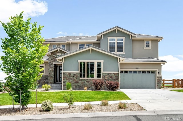 16262 W 95th Ln, Arvada, CO 80007 - view of front of home with stone siding, stucco siding, a garage, and concrete driveway