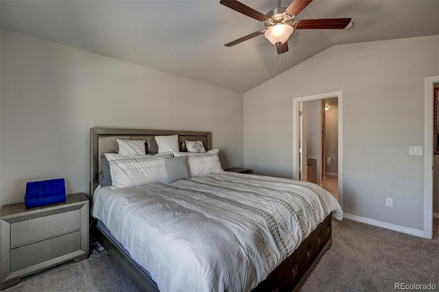 bedroom with lofted ceiling, connected bathroom, carpet, and ceiling fan