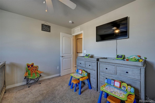 game room featuring light carpet and ceiling fan