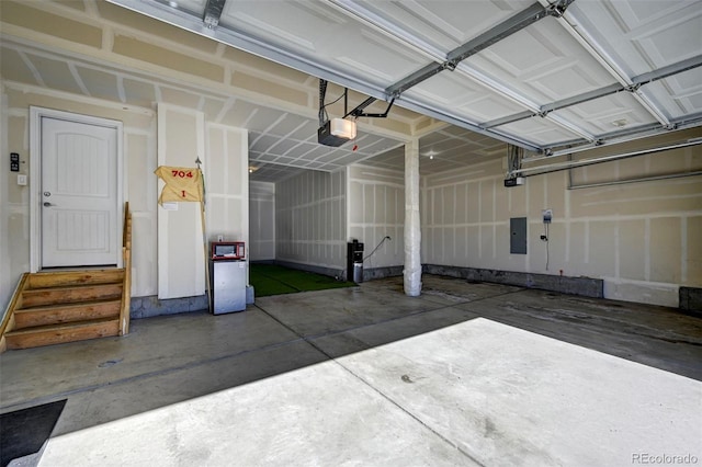 garage featuring a garage door opener and electric panel