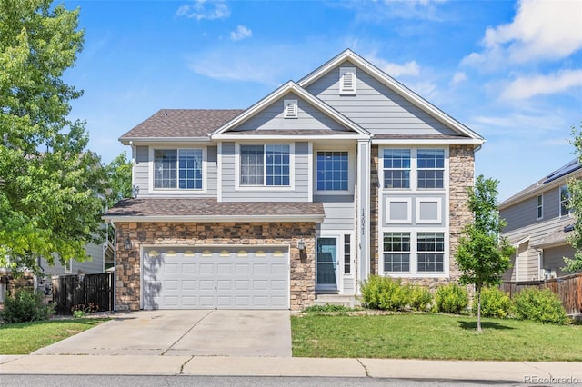 15021 Josephine St, Thornton, CO 80602 - view of front facade with concrete driveway, stone siding, and an attached garage