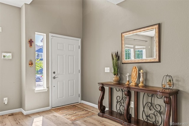15021 Josephine St, Thornton, CO 80602 - entryway featuring wood finished floors and baseboards