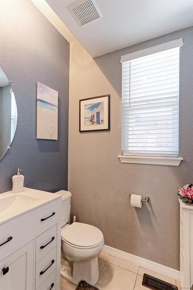 9994 Quintero St, Commerce City, CO 80022 - half bath featuring vanity, toilet, and plenty of natural light