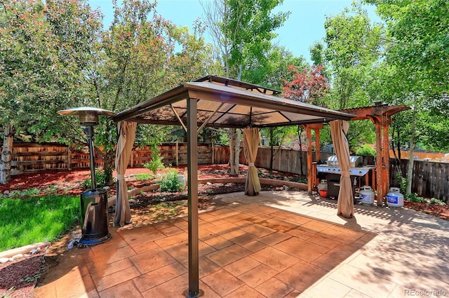 9994 Quintero St, Commerce City, CO 80022 - fenced backyard with a gazebo and a patio area