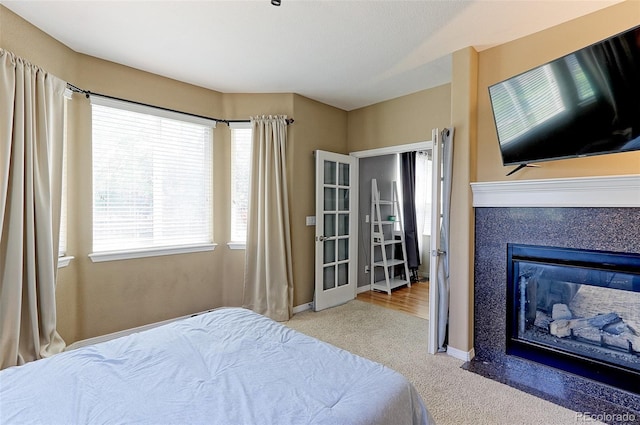 9994 Quintero St, Commerce City, CO 80022 - bedroom with carpet, baseboards, and a glass covered fireplace